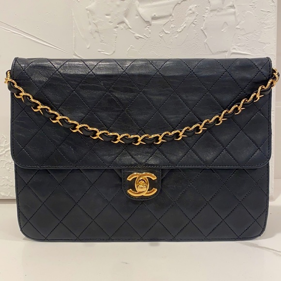 CHANEL Handbags - Authentic Vintage Chanel Lambskin Clutch on Chain